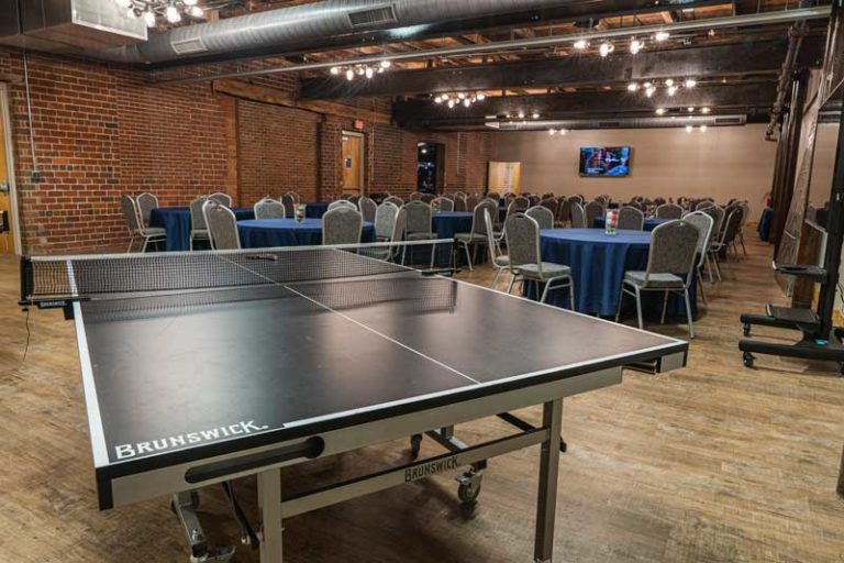 Large rental hall with seating and ping pong table